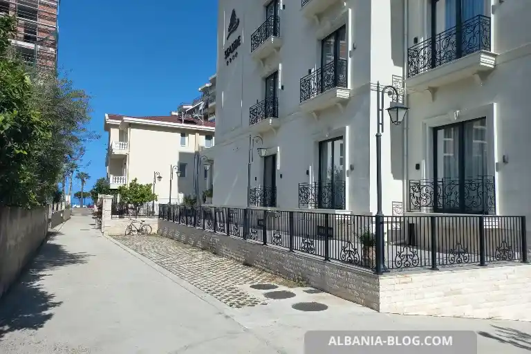 Sea Side hotel parking area in Vlore with outdoor spaces, underground garage entrance and road leading to Lungomare