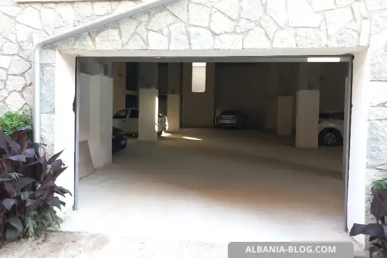 Entrance to underground parking at Valza Boutique Hotel Vlore with cars inside