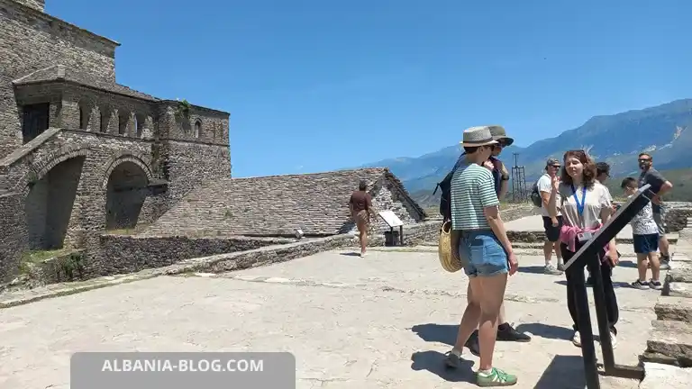 Tourists talking with a local guide at Gjirokaster Castle in Albania