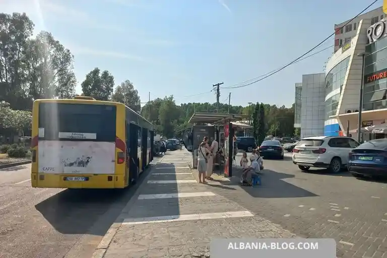 Yellow Durres city bus parked at the Plepa terminal near Rotonda shopping center