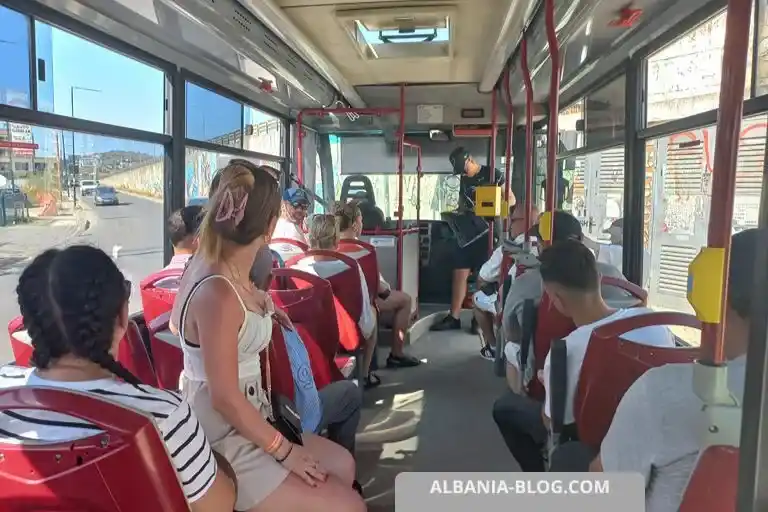 Small Iveco bus interior with 15 seats waiting at Golem bus terminal