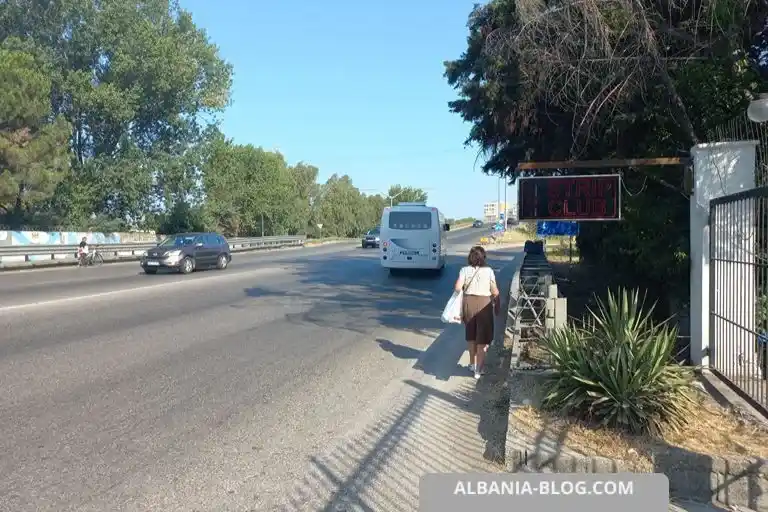 Plepa highway bus drop-off location near Durres with disembarking passengers and departing bus